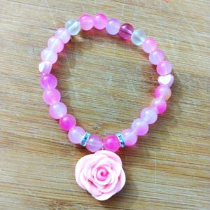 Pink shades of glass beads with a pink rose