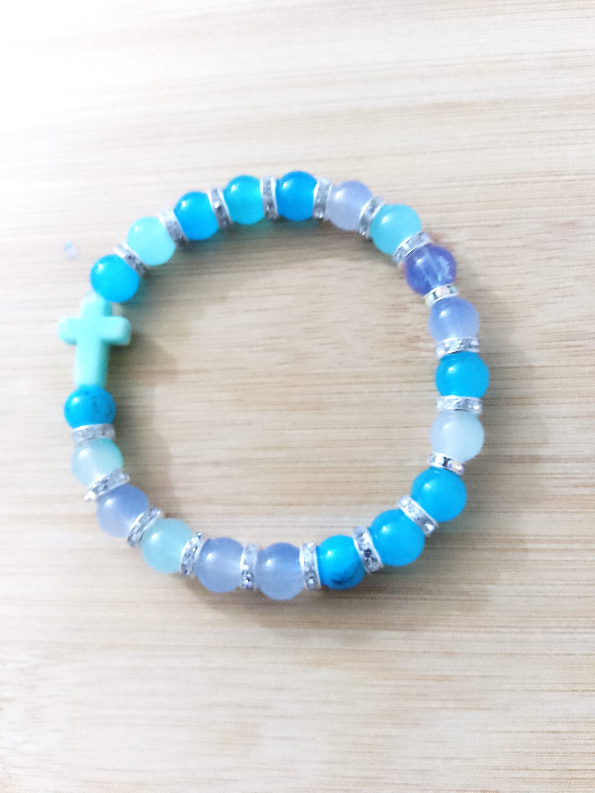 Shades of blue bracelet with a blue cross