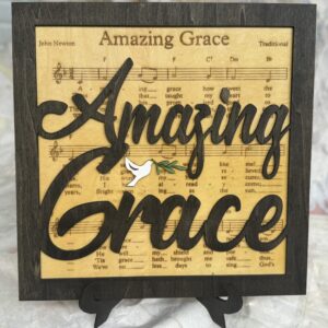 Amazing Grace on stand. With lyrics on wood.