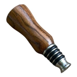 Handmade stainless steel bottle stopper with a turned red oak wood handle displaying natural grain and smooth finish.